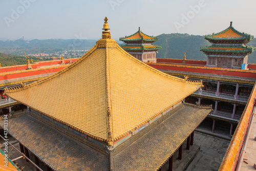 The temple top made of gold is in Chengde City, Hebei Province, China  photo