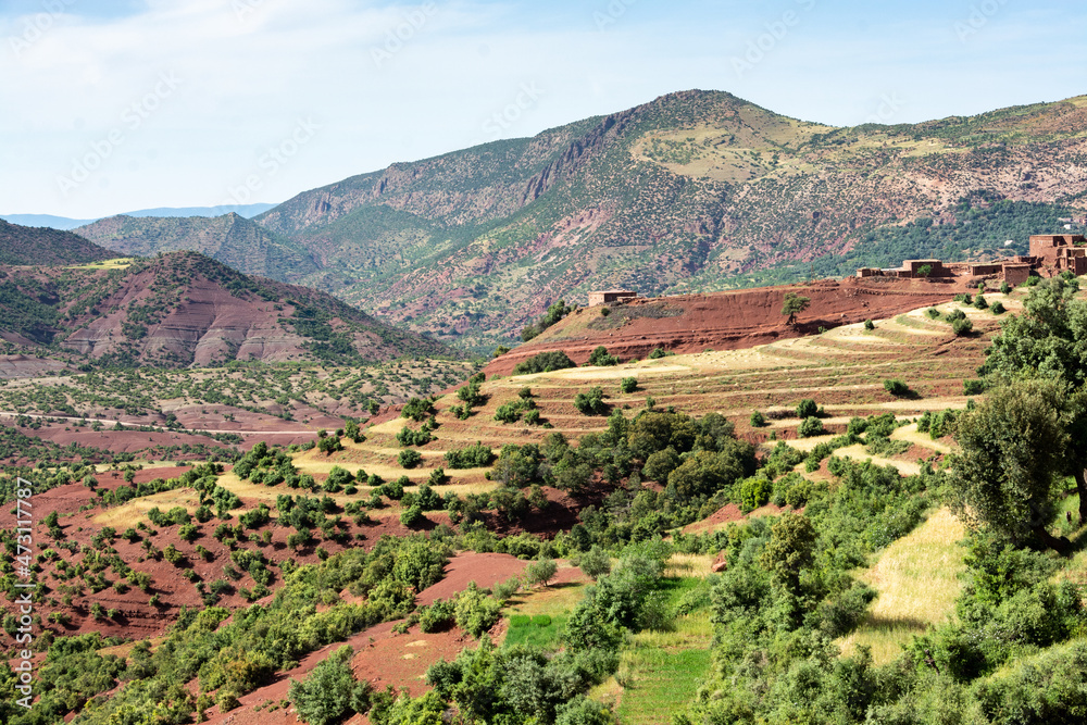 In the Atlas Mountains in Morocco. A village and a farm dominate the terraced crops on the slopes of the Ait Boulli valley