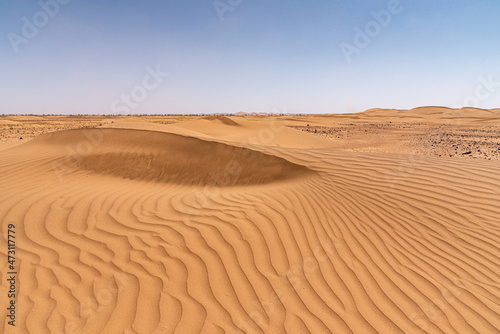 In the Sahara Desert in Morocco. The dunes of Erg Chegaga, with the furrows carved by the wind in the sand