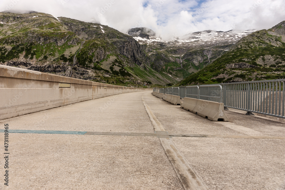 On the dam of the Malta dam with the mountains in the background. Carinthia. Austria