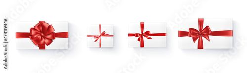 Realistic vector gift boxes with red ribbons isolated on white background. Holiday presents, top view illustration. Great for Christmas and birthday cards, shopping sale banners, gift certificates.