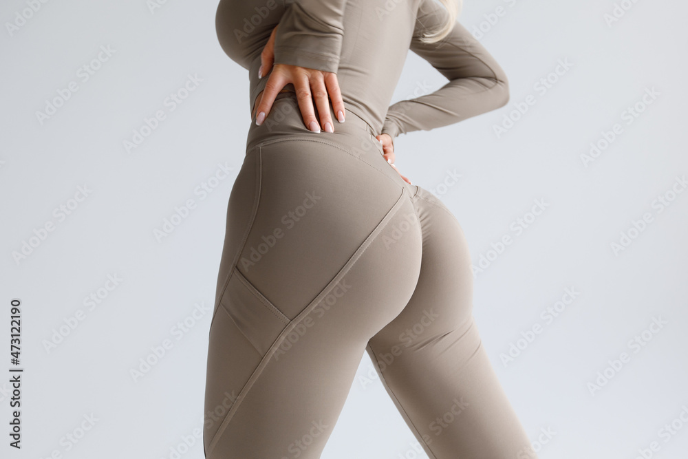 Fitness model in leggings with beautiful buttocks. Sporty booty Stock Photo