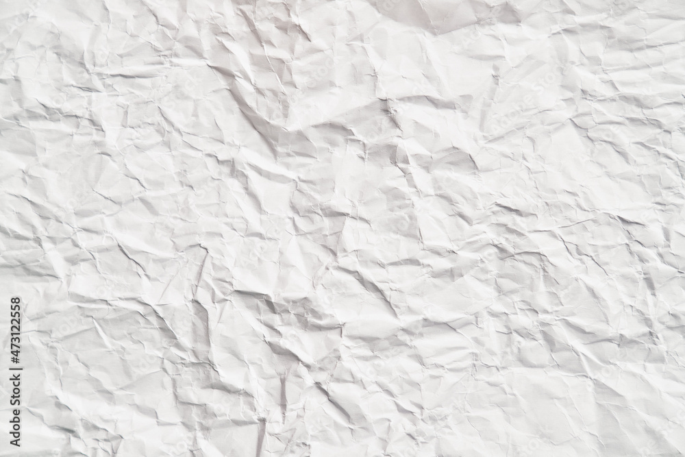 White crumpled paper texture with wrinkles. Damaged and torn sheet White crumpled paper texture with wrinkles. Damaged and torn sheet