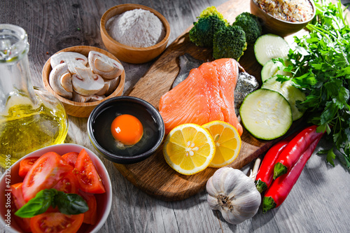 Fresh food ingredients prepared for cooking on a kitchen table