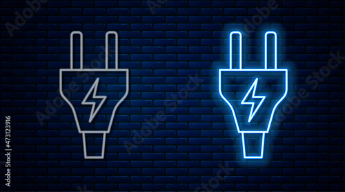 Glowing neon line Electric plug icon isolated on brick wall background. Concept of connection and disconnection of the electricity. Vector