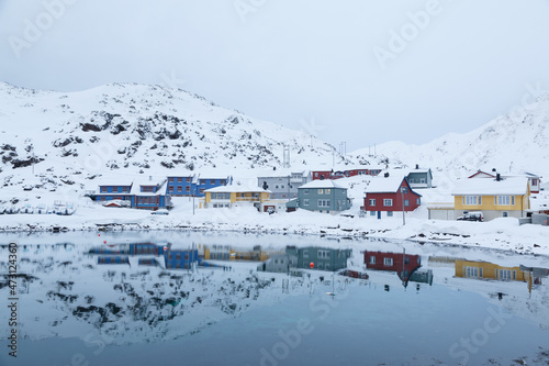 Houses between the ice and snow of the north cape