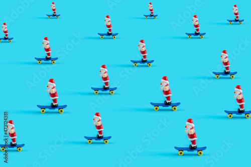 Santa Clauses riding skateboards as  New year concept  