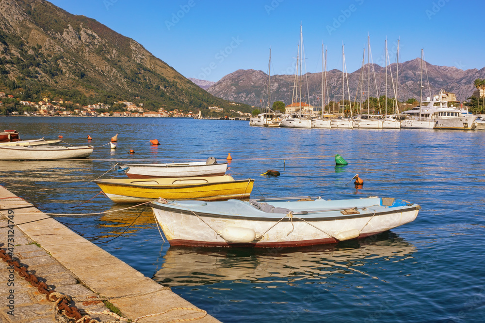 Sunny autumn Mediterranean landscape. Montenegro, Adriatic Sea.  View of  Kotor Bay near Old Town of Kotor. Fishing boats and yachts