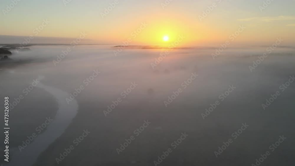 Sunrise in the Narew valley among the morning fog. Sunrise in the Narew valley among the morning fog.