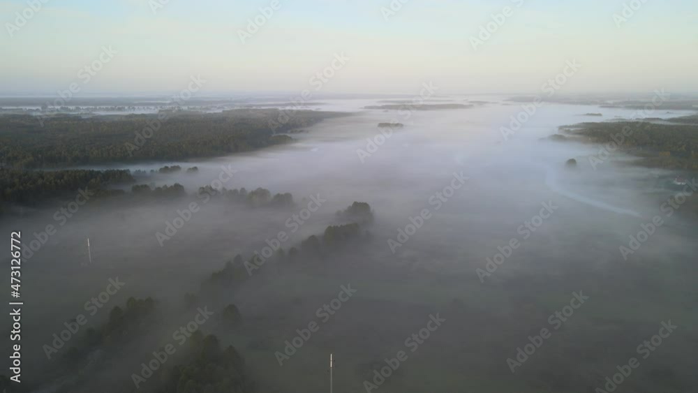 Sunrise in the Narew valley among the morning fog. Sunrise in the Narew valley among the morning fog.