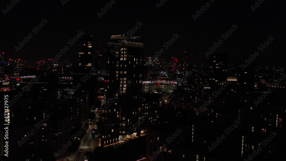 high rise buildings in urban neighbourhood. Aerial night city scene. London, UK high rise buildings in urban neighbourhood. Aerial night city scene. London, UK
