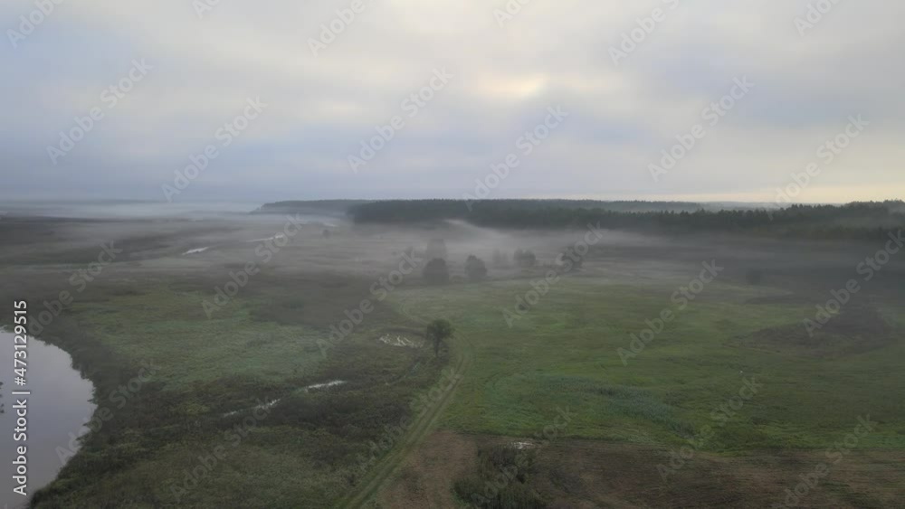 Sunrise in the Narew valley among the morning fog. Sunrise in the Narew valley among the morning fog.