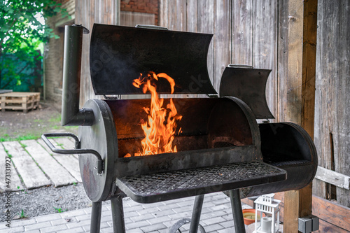 outdoor grill with fire before barbecue photo