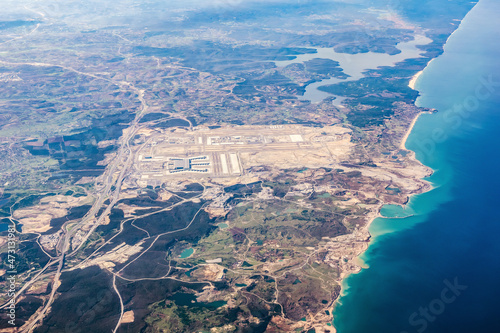 Sabiha Gokcen International Airport (SAW), Pendik district and Marmara Sea coastline aircraft view. Turkey, Istanbul. photo