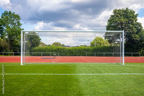 soccer goal on a green lawn on the field © edojob