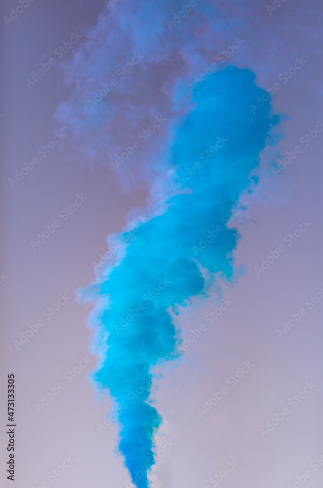 Naklejka premium Blue smoke on a blue background.