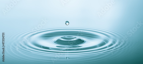 Splash of water droplets on a smooth water surface