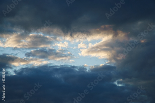 Clouds illuminated by the sun in the sky as background