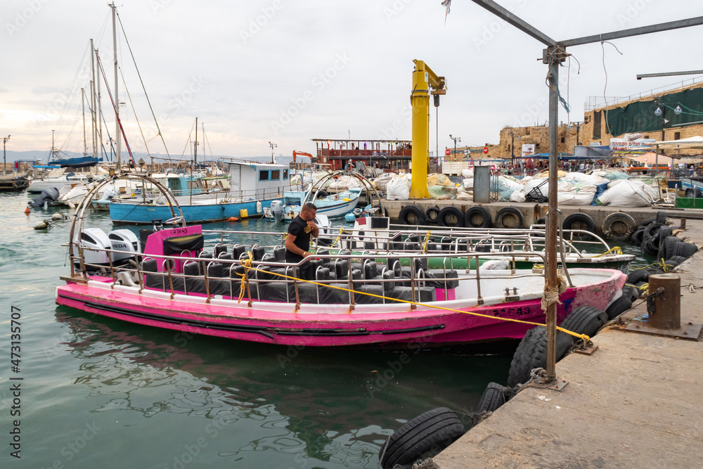 Yachts, fishing and tourist boats at the port in Acre old city, in northern Israel