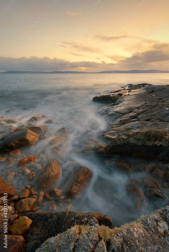 Obraz premium Beautiful coastal seascape sunset scenery of rocky coast at wild atlantic way in county Galway, Ireland, long, exposure, nature background, wallpaper