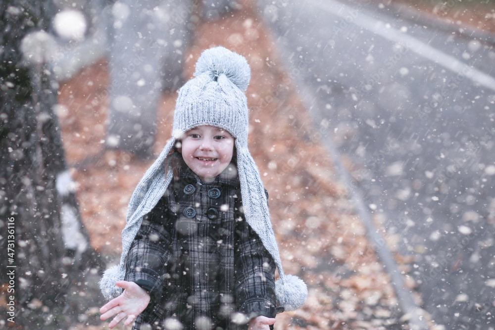 Kids walk in the park first snow Kids walk in the park first snow