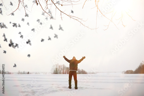 A man on a walk. Winter landscape. Tourist in winter journey.