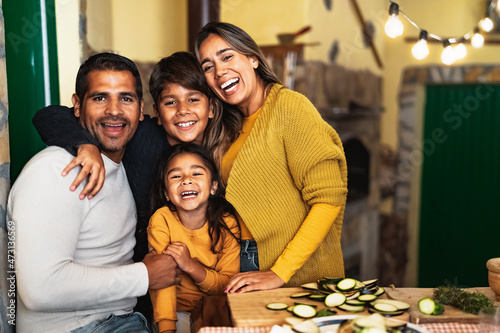 Happy Hispanic family enjoying holidays together at home