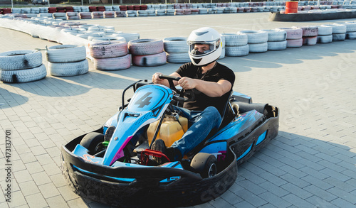 Bilde på lerret A young man drives a go kart at circuit