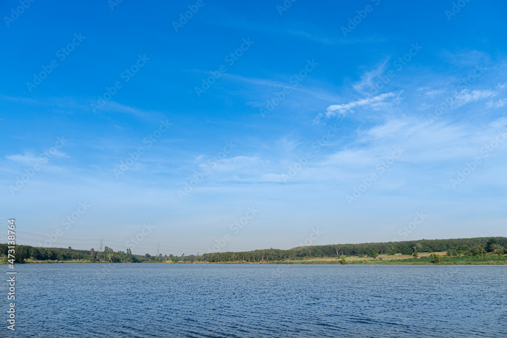 Landscape view of reservoir with green forest under blue sky. At Ang Kep Nam Dok Krai Rayong Thailand.