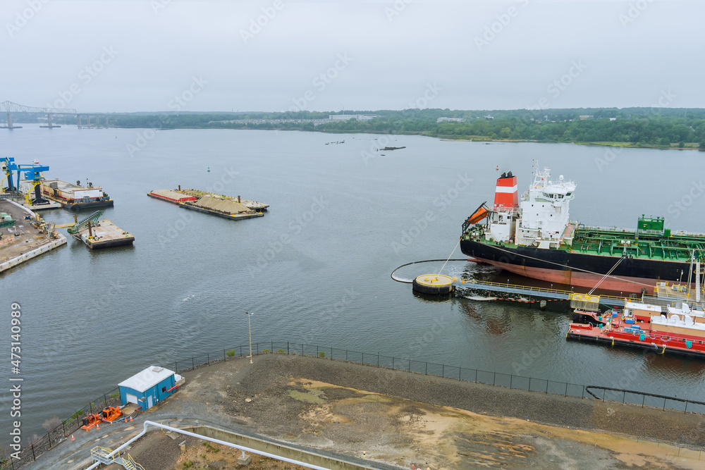Fototapeta premium Aerial view tanker ship, oil ship operation during petroleum transfer