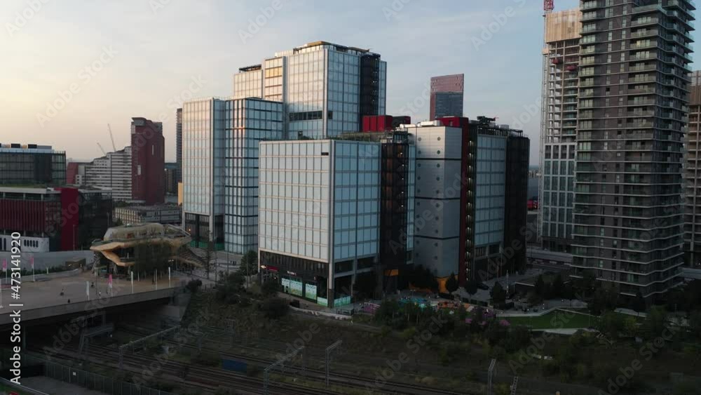 descending view high futuristic commercial skyscrapers panorama in sunny day in great britain