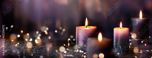 Konstfotografi Advent Candles - Four Purple Votive Candlelight In Church With Defocused Abstrac