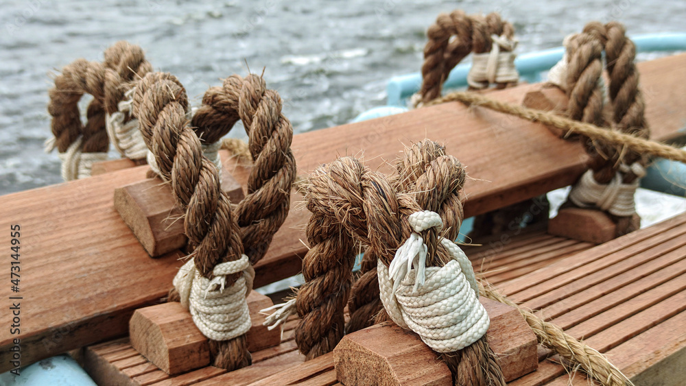 Fotografie, Obraz Stormtrap made of Manila rope, fixed on board the ship near the rail