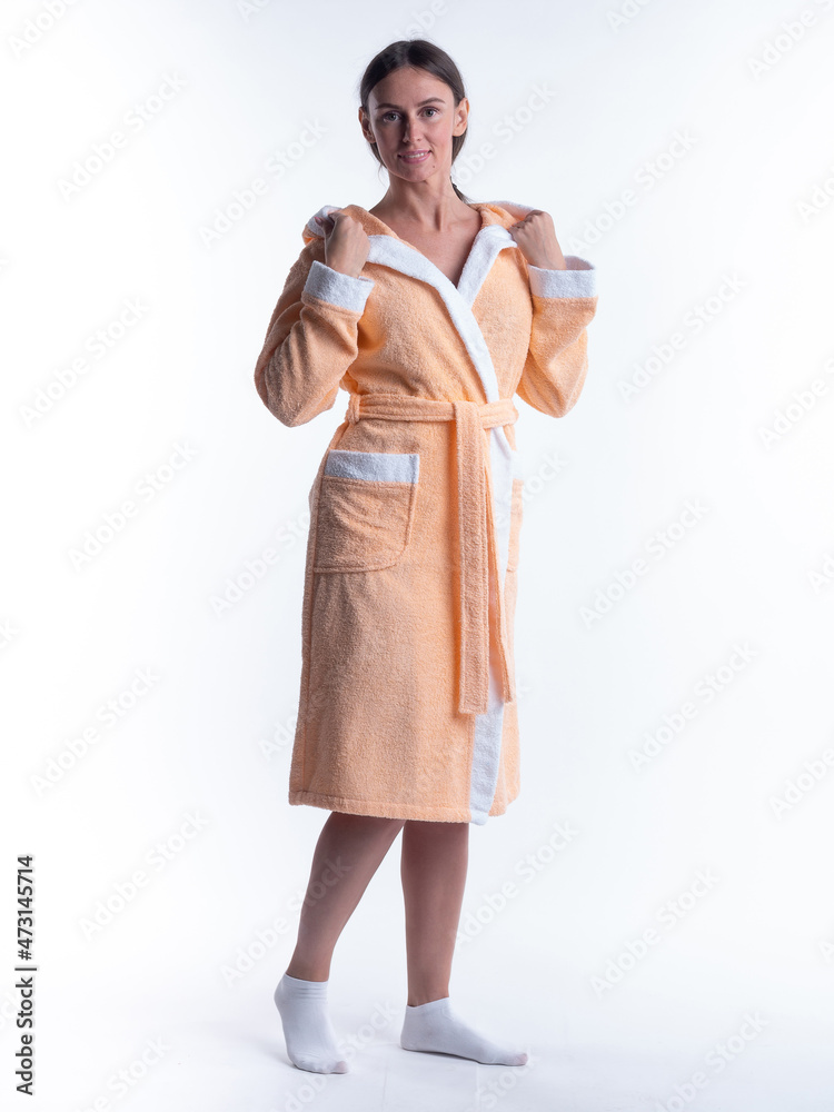 woman in a Bathrobe on an isolated white background with a smile on her face. woman in a Bathrobe on an isolated white background with a smile on her face.