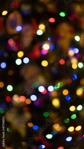 Multicolor Christmas bokeh abstract winter background. Circular points. Colorful.
