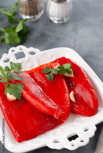 Marinated red bell peppers on a white plate