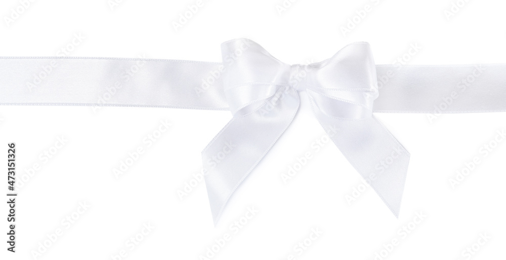 Fototapeta premium Satin ribbon with bow on white background, top view