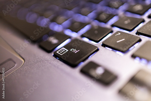 Control button  Keyboard ctrl  press type close up macro desktop laptop computer black silver. keyboard with light  photo