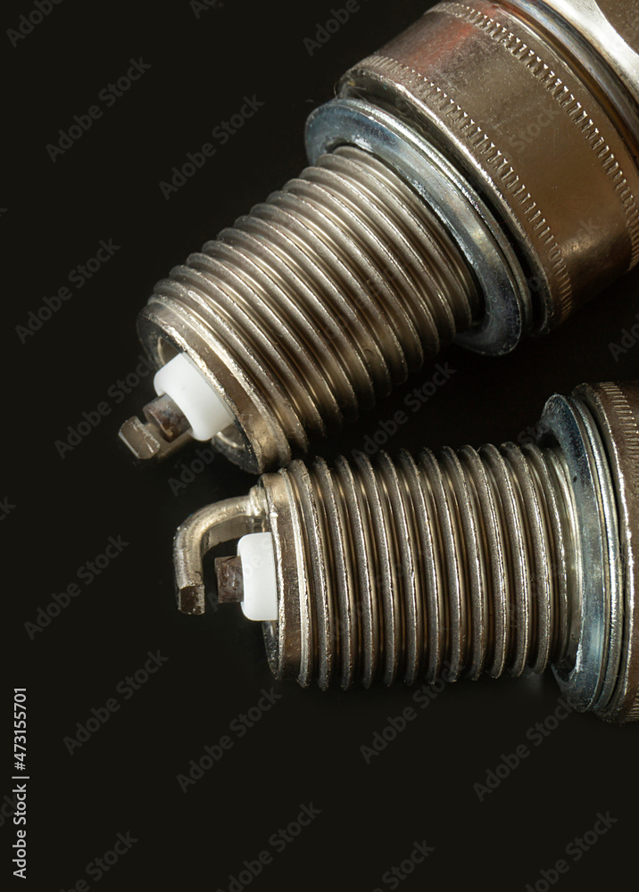 Car spark plug on dark background Car spark plug on dark background