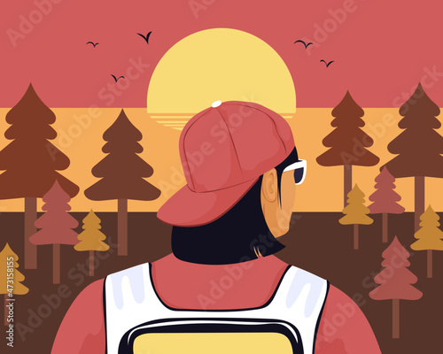 Backpacker exploring in forest at sunset