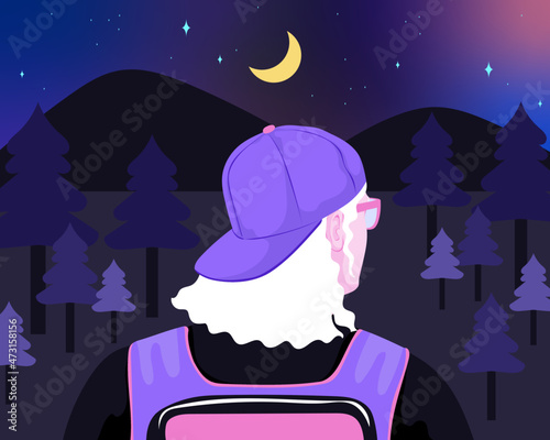 Hipster backpacker hiking in forest at night