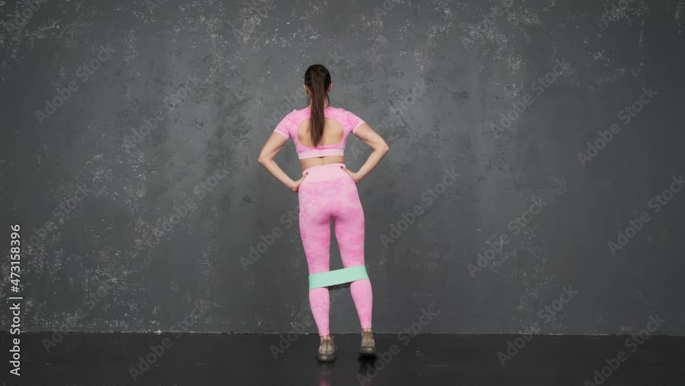 Energetic girl doing buttocks workout. Back view. A young woman is doing a workout for weight loss. Slow motion
Energetic girl doing buttocks workout. Back view. A young woman is doing a workout for weight loss. Slow motion