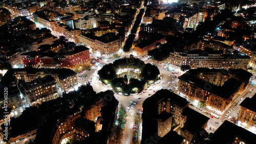 Canvas Print Aerial drone night shot of iconic illuminated Mazzini square with beautiful arch