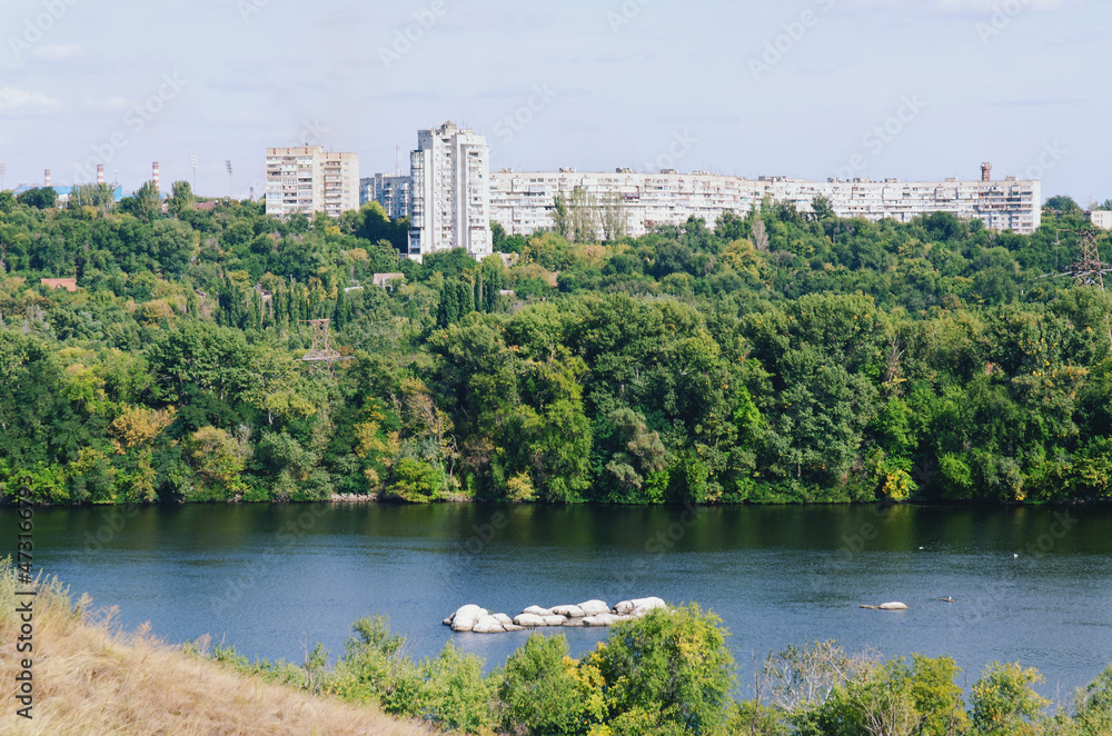 Ukraine, Zaporozhye. View of the blue Dnieper river with rocks, green hills. Khortytsya Island. Center of Ukrainian Cossacks. Dam Dneproges. Ukraine, Zaporozhye. View of the blue Dnieper river with rocks, green hills. Khortytsya Island. Center of Ukrainian Cossacks. Dam Dneproges.