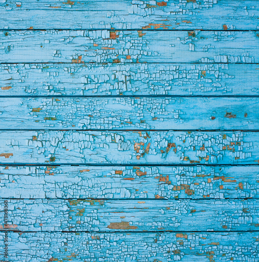 Obraz premium Wooden surface with cracked blue paint