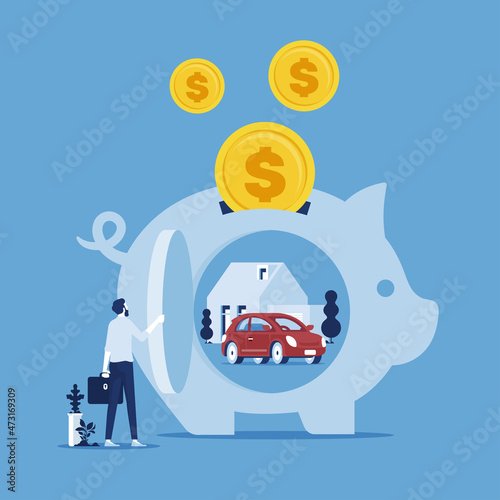 Businessman putting coin in piggy bank, saving for car and home, saving and investing money concept