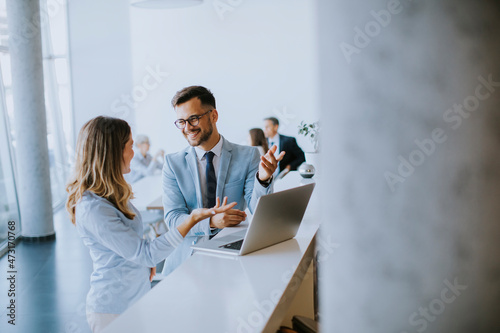 Young business couple worki...