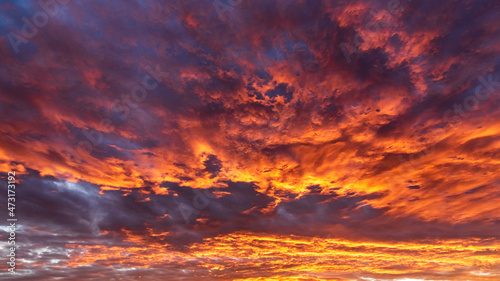 Colorful cloudy sky at sunset. Dramatic sunset sky with clouds. Sky texture, nature background.