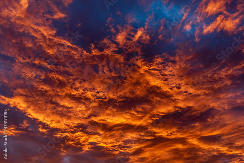 Colorful cloudy sky at sunset. Dramatic sunset sky with clouds. Sky texture, nature background.