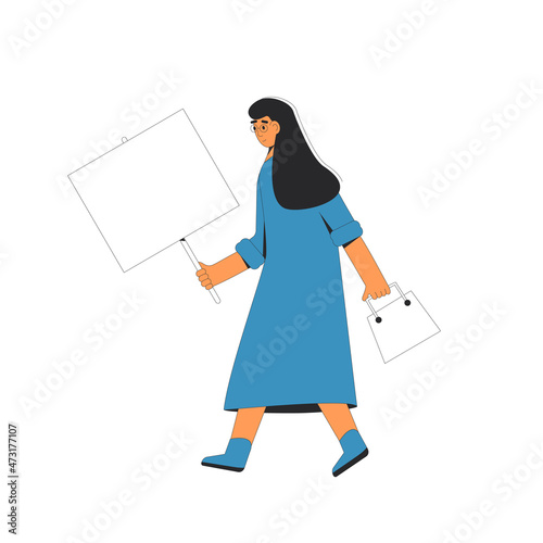 Woman walking and holding blank banner in her hand.